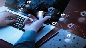 A close-up of a laptop screen showing interconnected blockchain nodes, representing secure decentralized network systems.