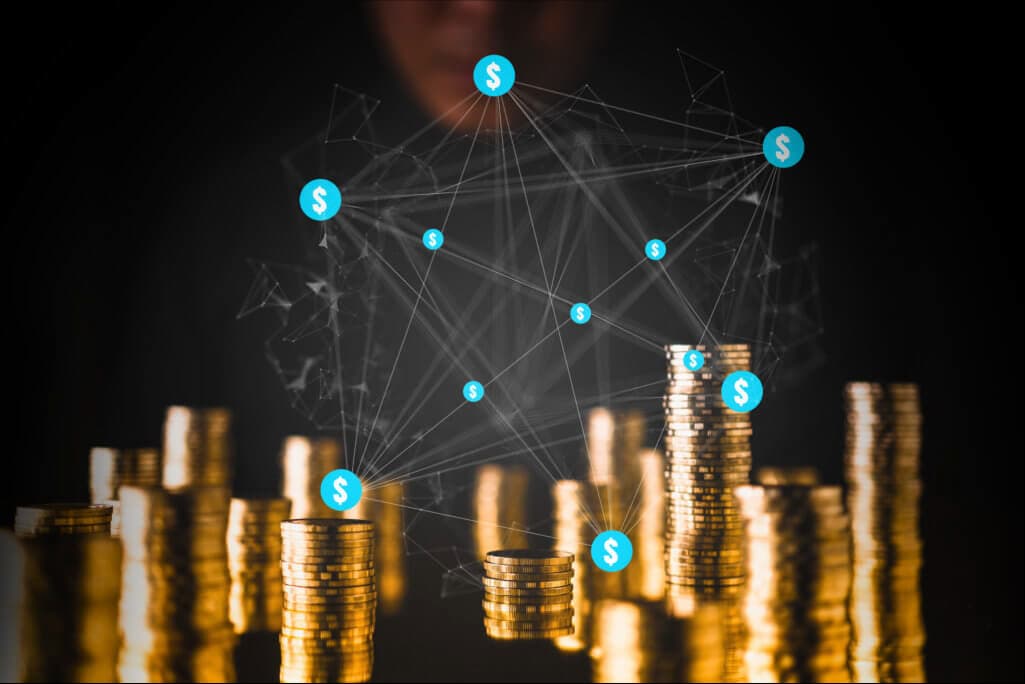 A stack of gold coins connected by digital nodes, illustrating blockchain monetization and virtual economy opportunities within Meta Stadium.