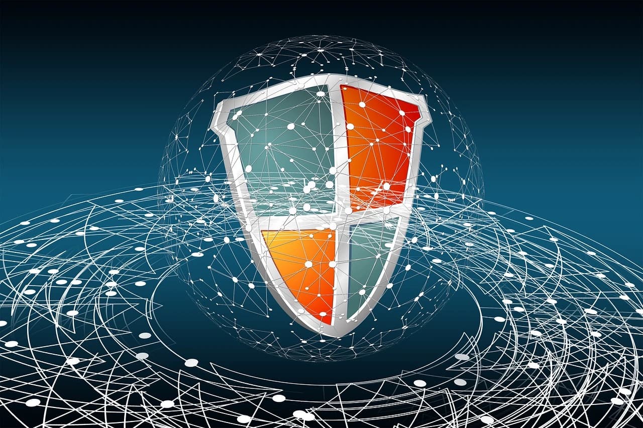 A shield surrounded by a network of interconnected lines, symbolizing cybersecurity and data protection.