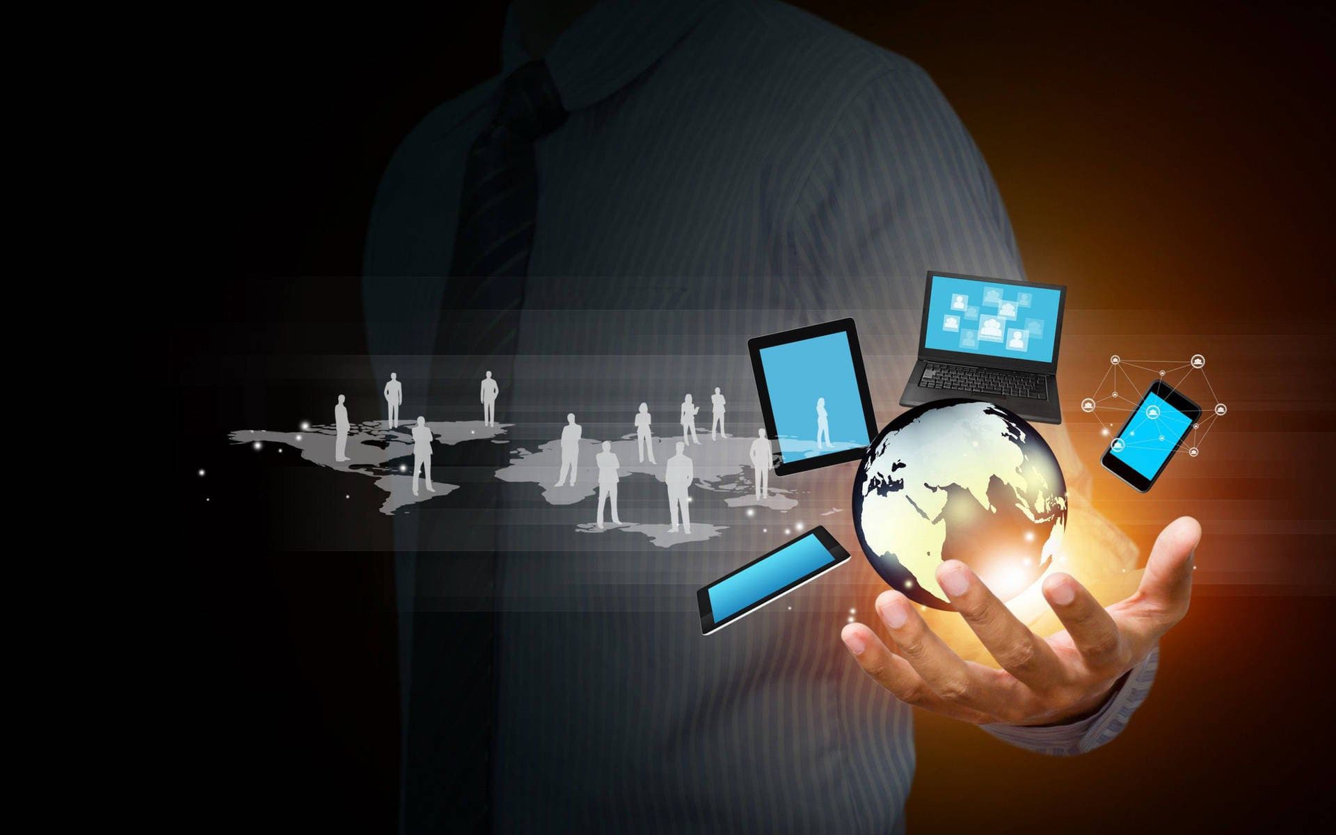 A person holding a globe with interconnected technology icons such as laptops, phones, and user symbols, representing global reach and connectivity.