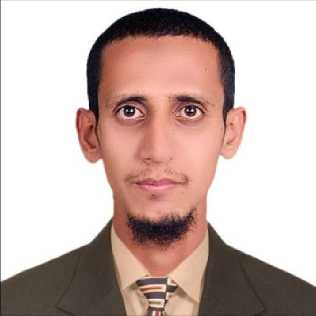Headshot of Umer Khan in formal attire with a light background.